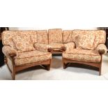 A retro 1970's G-Plan teak wood suite. Comprising of the large 3 seat sofa settee with show wood