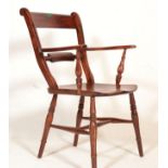 An antique oak railback armchair / chair having shaped armrest with single railback support and