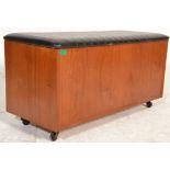 A mid century teak wood blanket box chest of rectangular form with hinged top opening to reveal open