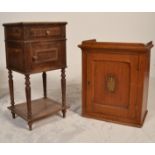 A 19th century French country oak and marble pedestal pot stand cupboard with carved detailing