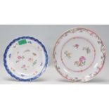 Two Chinese 19th Century polychrome porcelain plates to include a famille rose shallow bowl