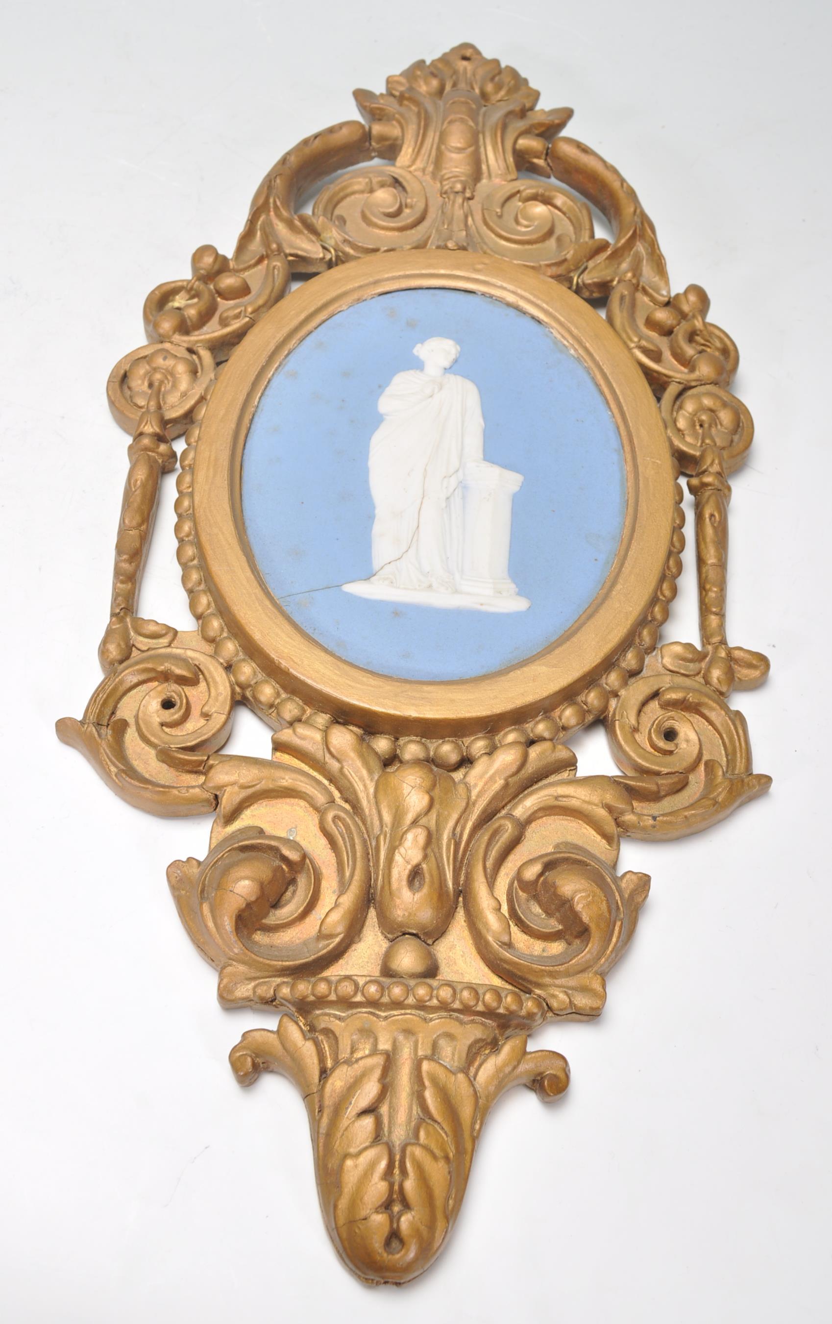 A pair of 19th century Wedgwood cameo plaques inset with classical scholars to each on oval blue - Image 3 of 7