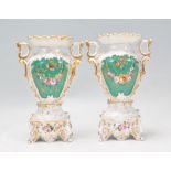 A pair of 19th Century Victorian porcelain mantelpiece garniture vases of tapering form having