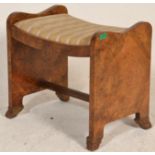 A mid century Queen Anne walnut dressing table stool. Raised on shaped legs with shell feet having a