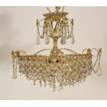 A pair of antique style gilt metal empire revival multi swah branch chandeliers, each with