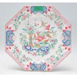 A Chinese / Japanese famille rose plate of octagonal form having hand enamelled floral decoration