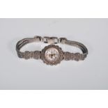 A vintage 20th Century silver and marcasite ladies wristwatch having a later add quartz movement and