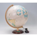 A retro 20th century desk top globe with wooden swivel base having a swivel mount.