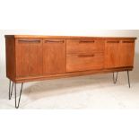 Meredew - An original 1960's retro vintage teak wood sideboard credenza comprising a central bank of