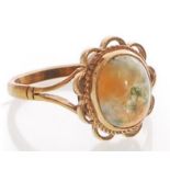 A hallmarked 9ct gold and moss agate ring. Hallmarked Birmingham. Size R.  2.7g