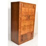 A 1930's Art Deco walnut tallboy having stunning s