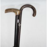 A pair of 20th Century walking sticks to include a