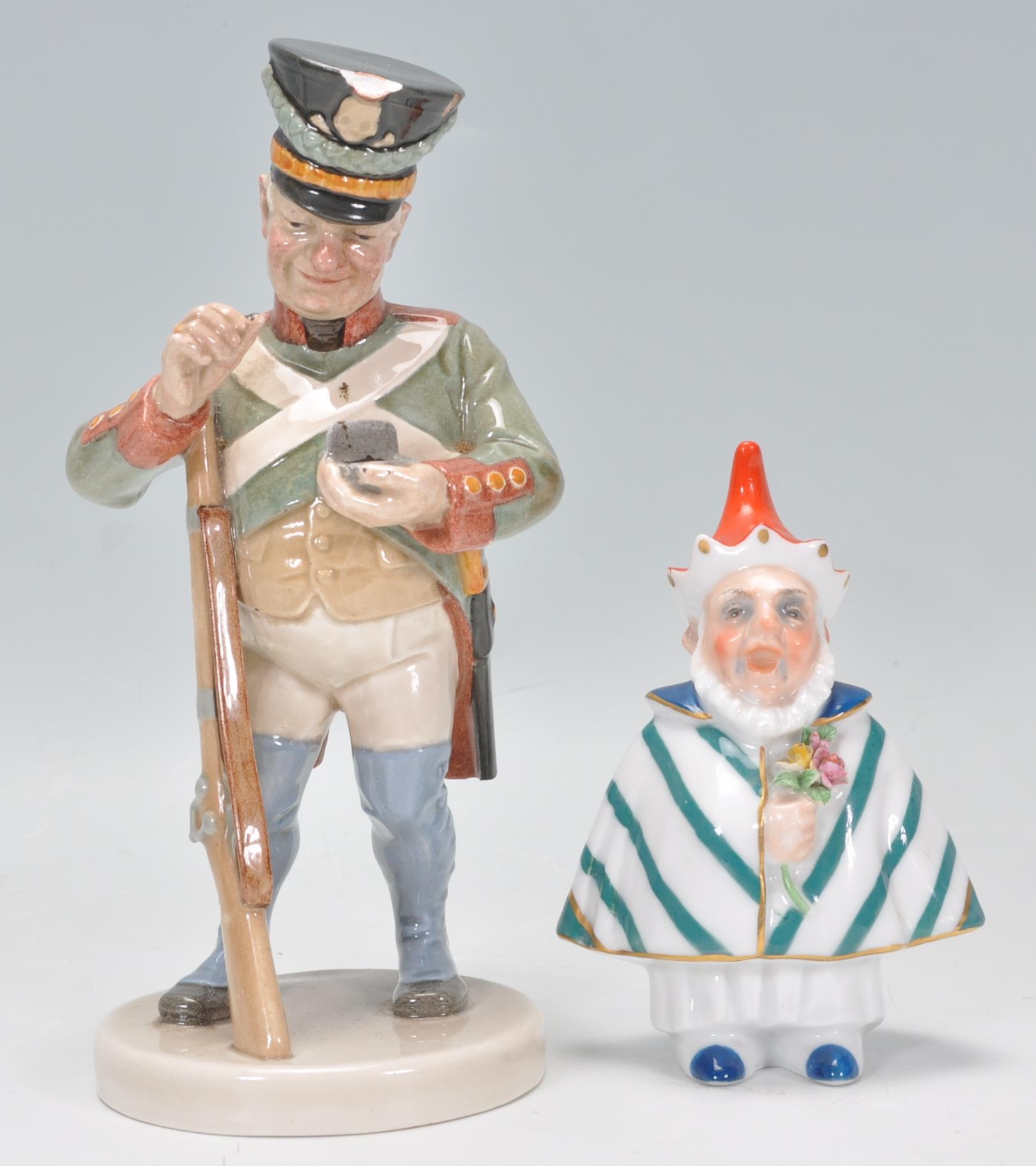 A Villeroy and Boch figurine of a soldier taking snuff raised on a round plinth base (no.1811