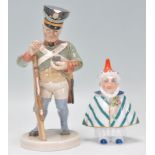 A Villeroy and Boch figurine of a soldier taking snuff raised on a round plinth base (no.1811