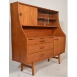 A good retro 20th Century teak wood highboard / sideboard credenza having a glazed and concealed