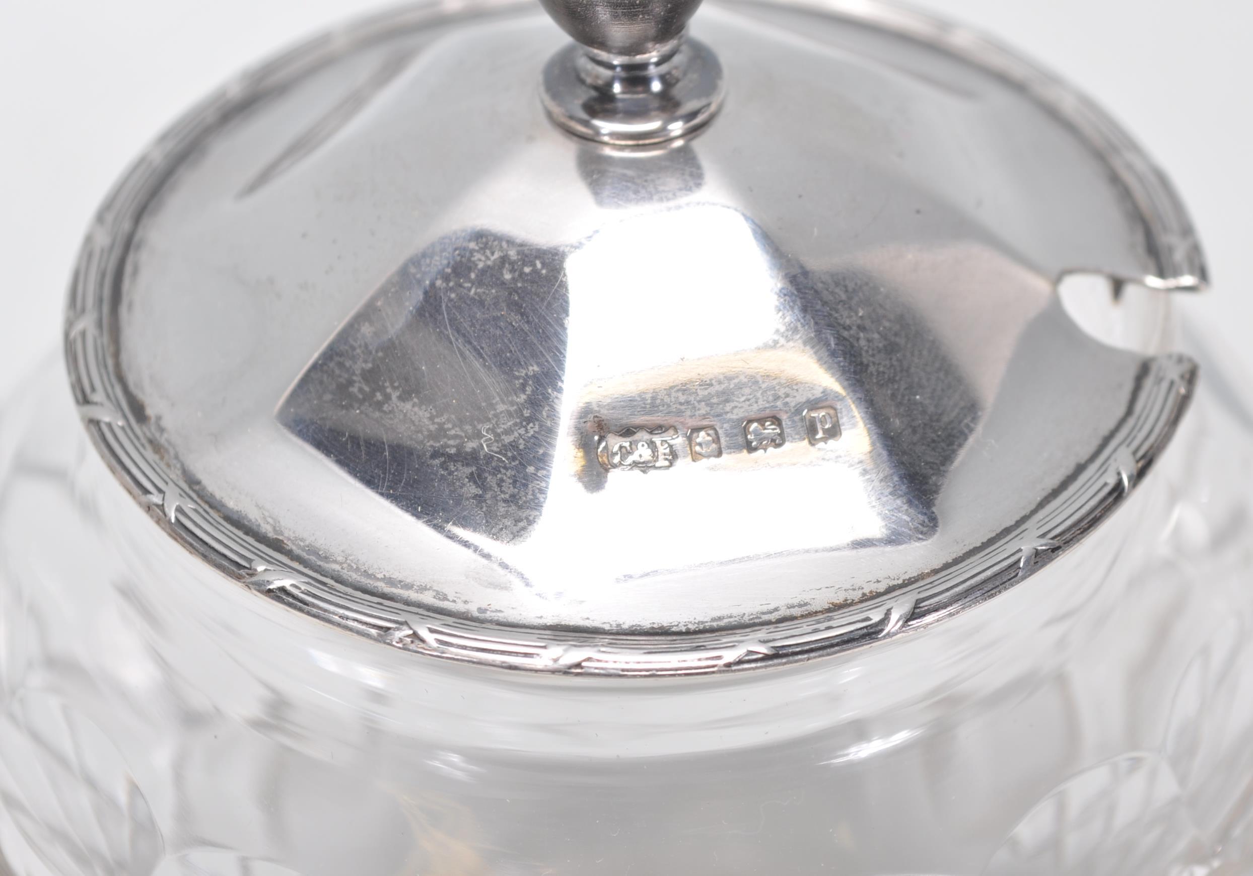 A group of three cut glass and silver items to include a jam pot having a silver hallmarked lid with - Image 3 of 5