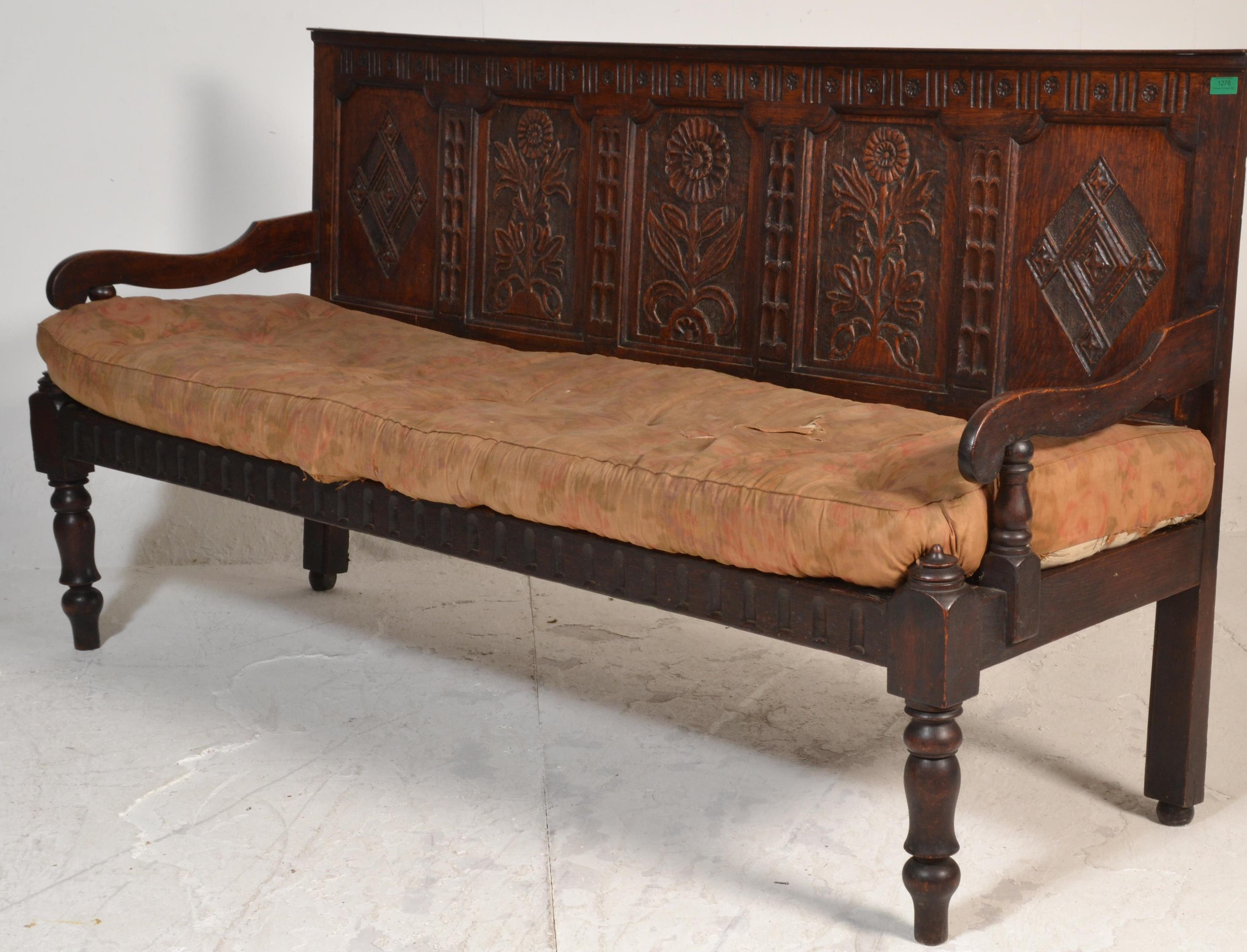 An 18th century large carved West country oak hall settle bench. Raised on turned legs with - Image 5 of 6