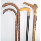 A collection of walking sticks to include blackthorn and horn topped example, silvered collar