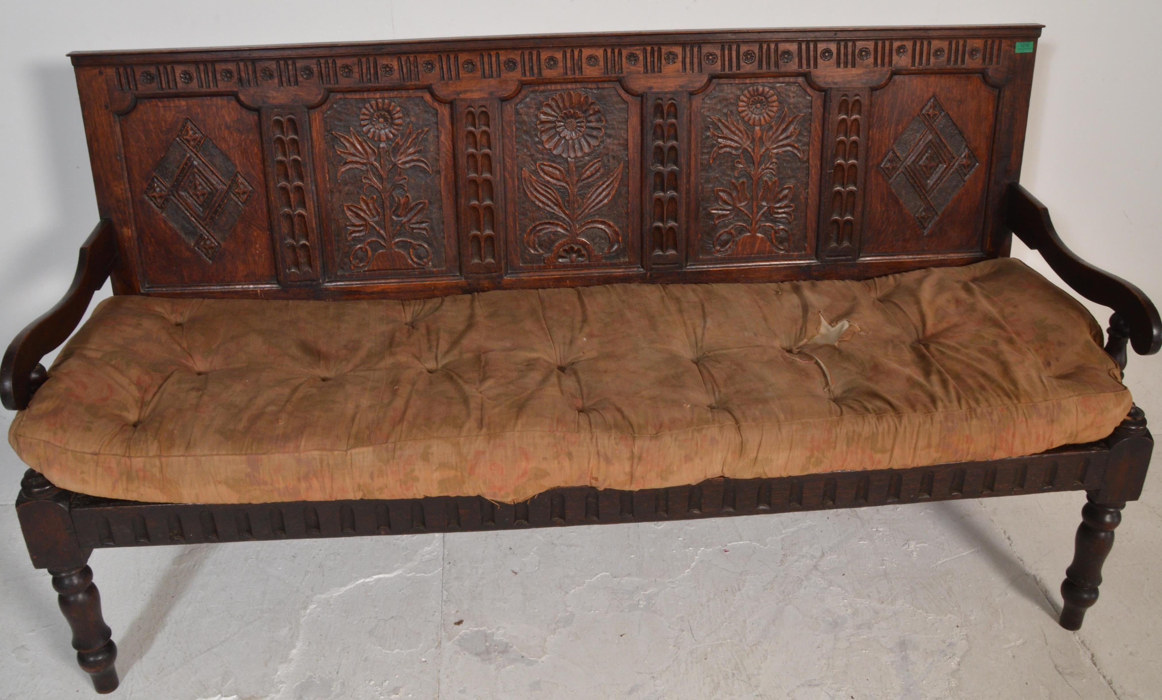 An 18th century large carved West country oak hall settle bench. Raised on turned legs with - Image 4 of 6