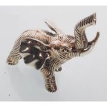 A cast sterling silver figure of an elephant trumpeting. Gross weight 27 grams.