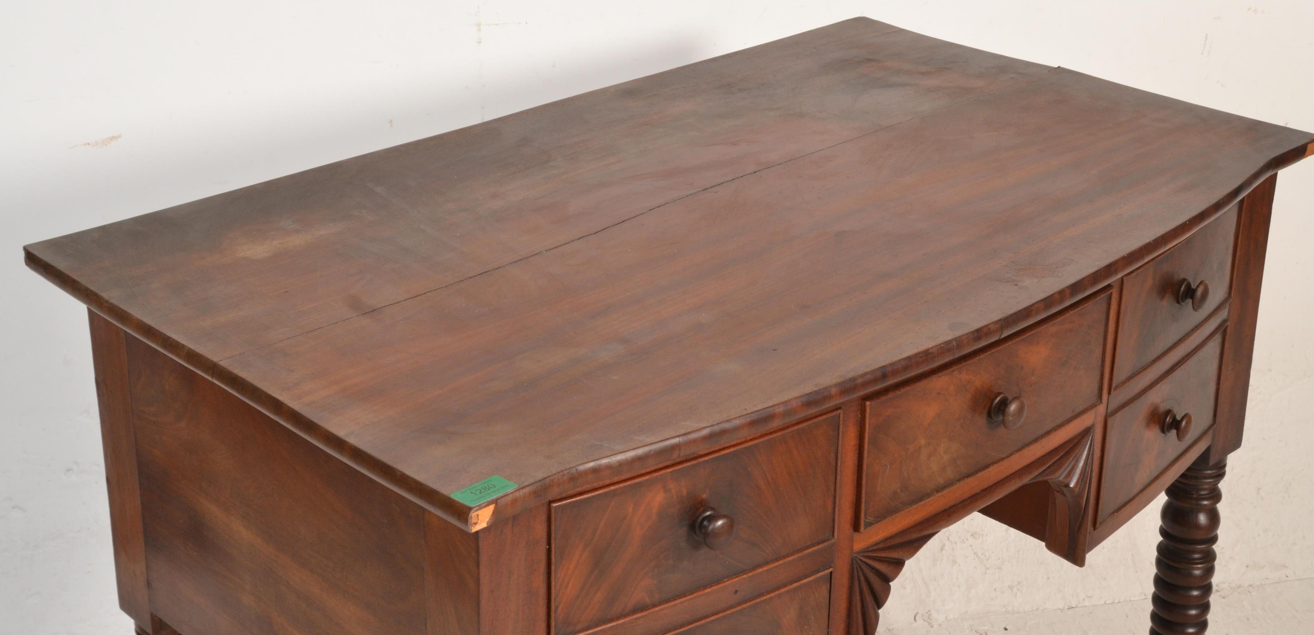 A 19th century George III mahogany bow fronted writing table desk. Raised on bobbin supports - Image 2 of 7