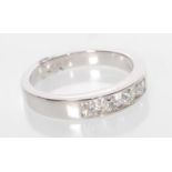 A platinum eternity ring channel set with 4 round cut diamonds. Diamonds estimated at 40pts total.
