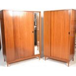 A mid century retro Austinsuite teak wood matching set of ladies and gentlemans wardrobes having