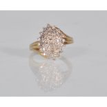 A stamped 9ct gold and diamond ring having pave set cluster of white stones. Weighs 4.2g. Ring