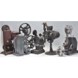 A group of five vintage cine projectors to include a Bell and Howell filmo 5.7 projector, a Kodak