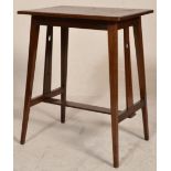 An Edwardian mahogany inlaid Arts  & Crafts side table in the manner of Godwin. Raised on angled