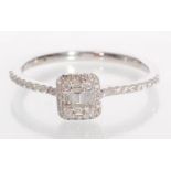 An 18ct white Gold diamond cluster ring having a square head set with rectangular and round cut