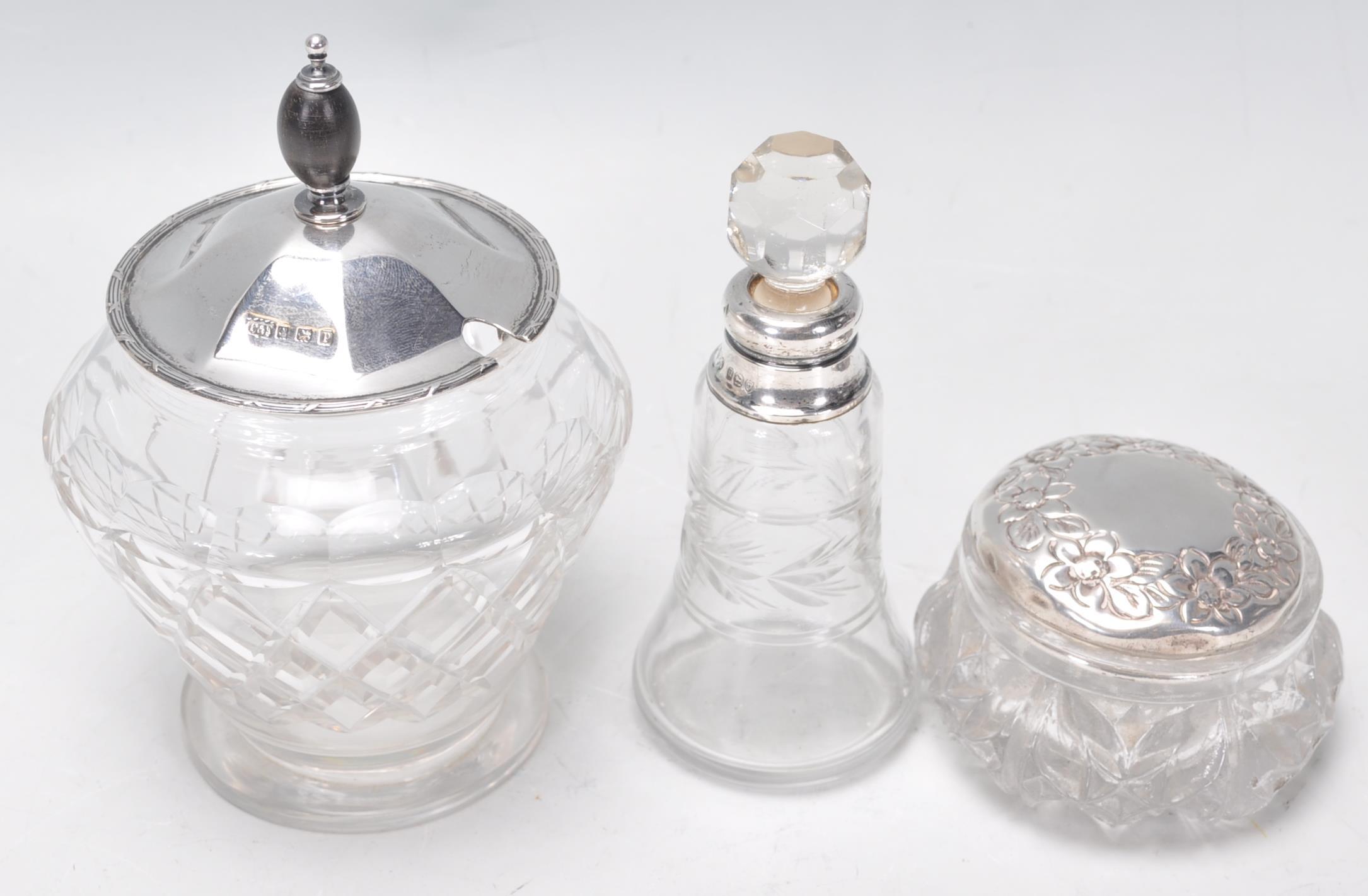 A group of three cut glass and silver items to include a jam pot having a silver hallmarked lid with - Image 2 of 5