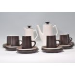 A retro mid century studio pottery coffee service by Beswick England. The two tone colourway service
