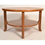 A 1960's retro vintage teak wood round two tier co