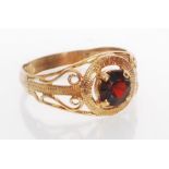 A hallmarked 9ct gold and garnet ring. Hallmarked London. Weight 1.8g. Size P.