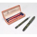 A rare red marbled effect " Rosemary - That's for Remembrance " fountain pen and pencil set by