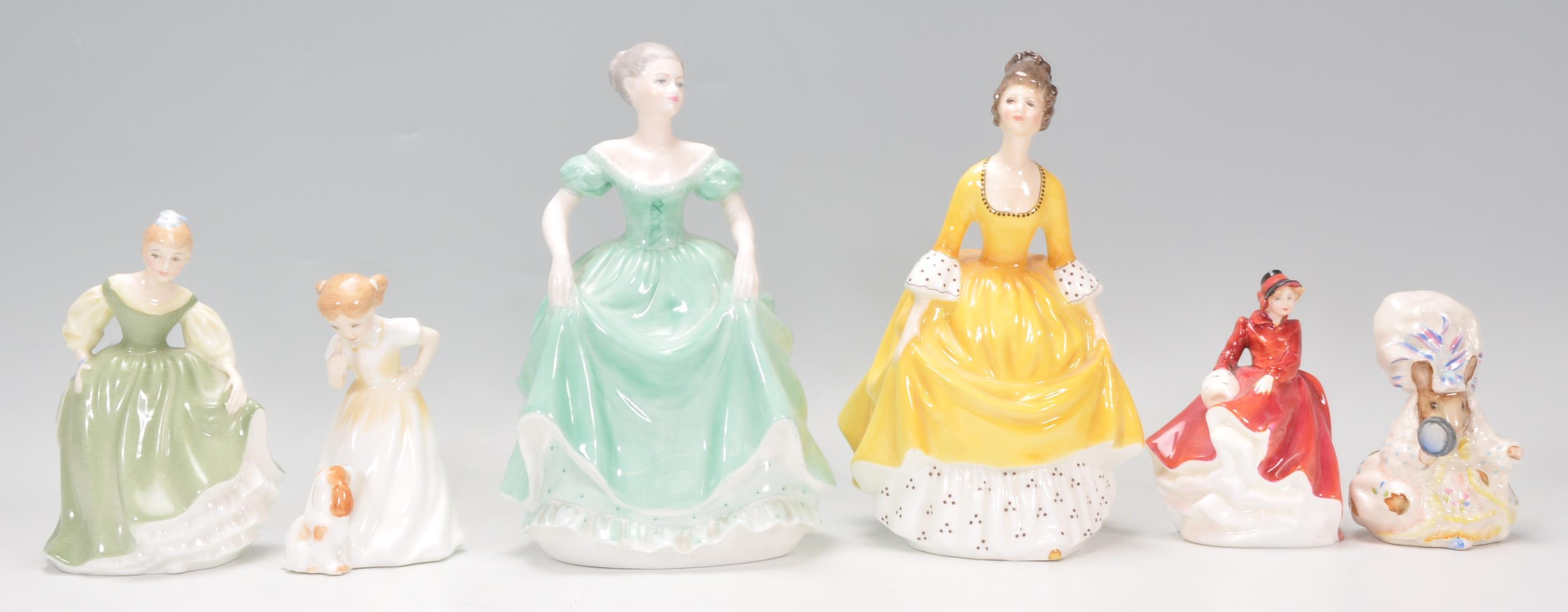 A mixed collection of ceramic figurines to include three Royal Doulton ladies one Emma HN 3208,