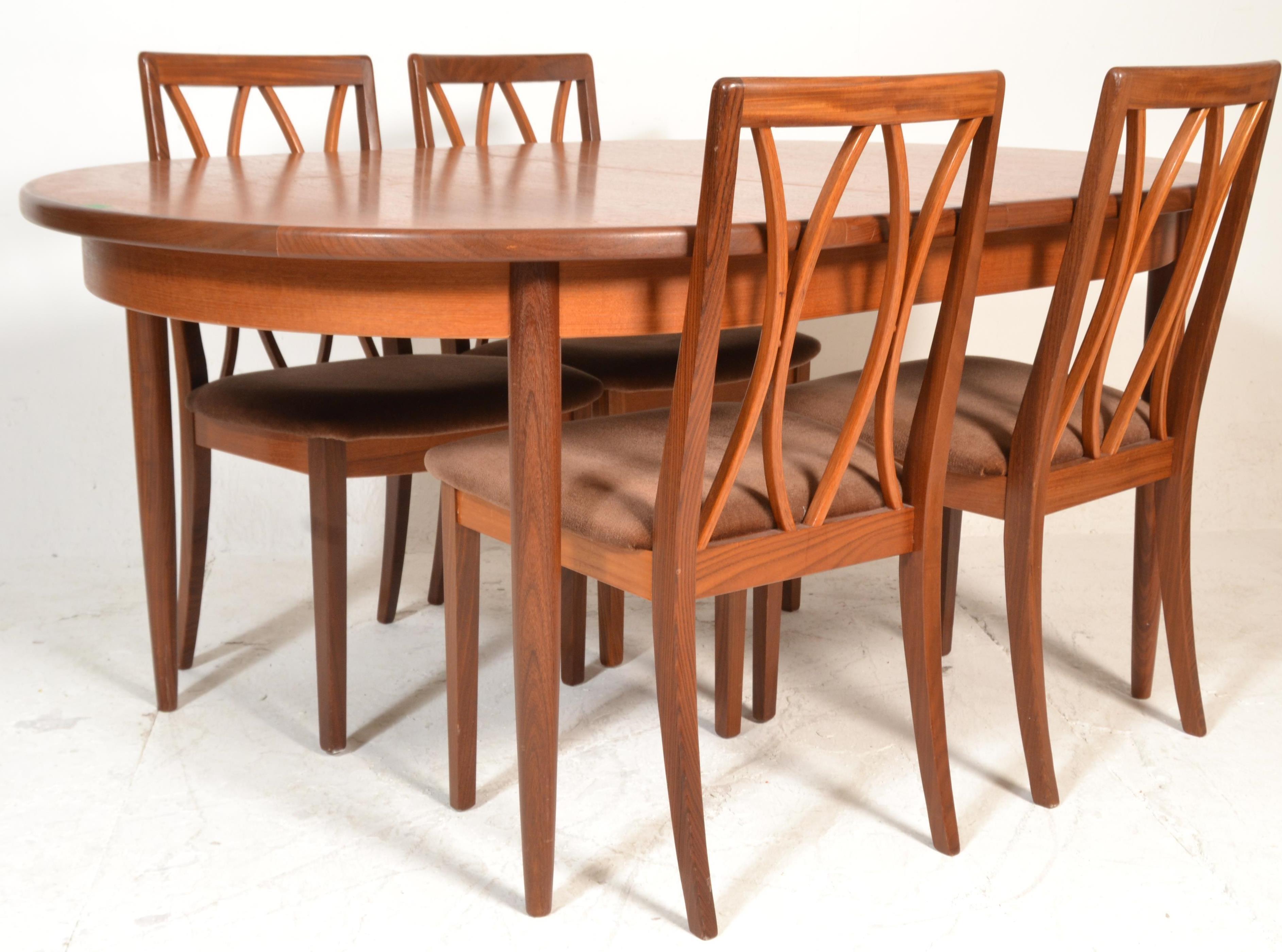 A 1960's mid 20th Century G Plan Fresco range teak wood extendable dining table having an oval top