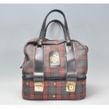A group of four vintage Almark bowls together within a Dawn DeLuxe bowl bag being tartan print