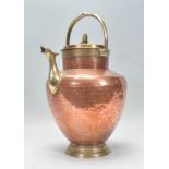 An antique believed 19th century Islamic copper and brass water carrier with decorative shaped