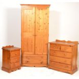 An antique style pine bedroom suite comprising a chest of drawers with 2 over 3 configuration