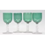 A matching set of four 19th Century Georgian Bristol Green drink glasses having green round