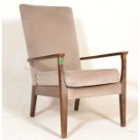 A mid century Parker Knoll armchair. Raised on squared legs with show wood shaped elbow supports