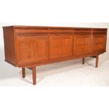 A mid century Scandinavian / Danish design teak wood sideboard credenza being raised on square