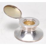 A good 20th Century silver hallmarked captains inkwell with hinged lid. Hallmarked for Birmingham
