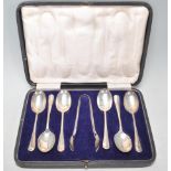 A cased set of early 20th Art Deco silver hallmarked rat tail coffee spoons. Six in total with