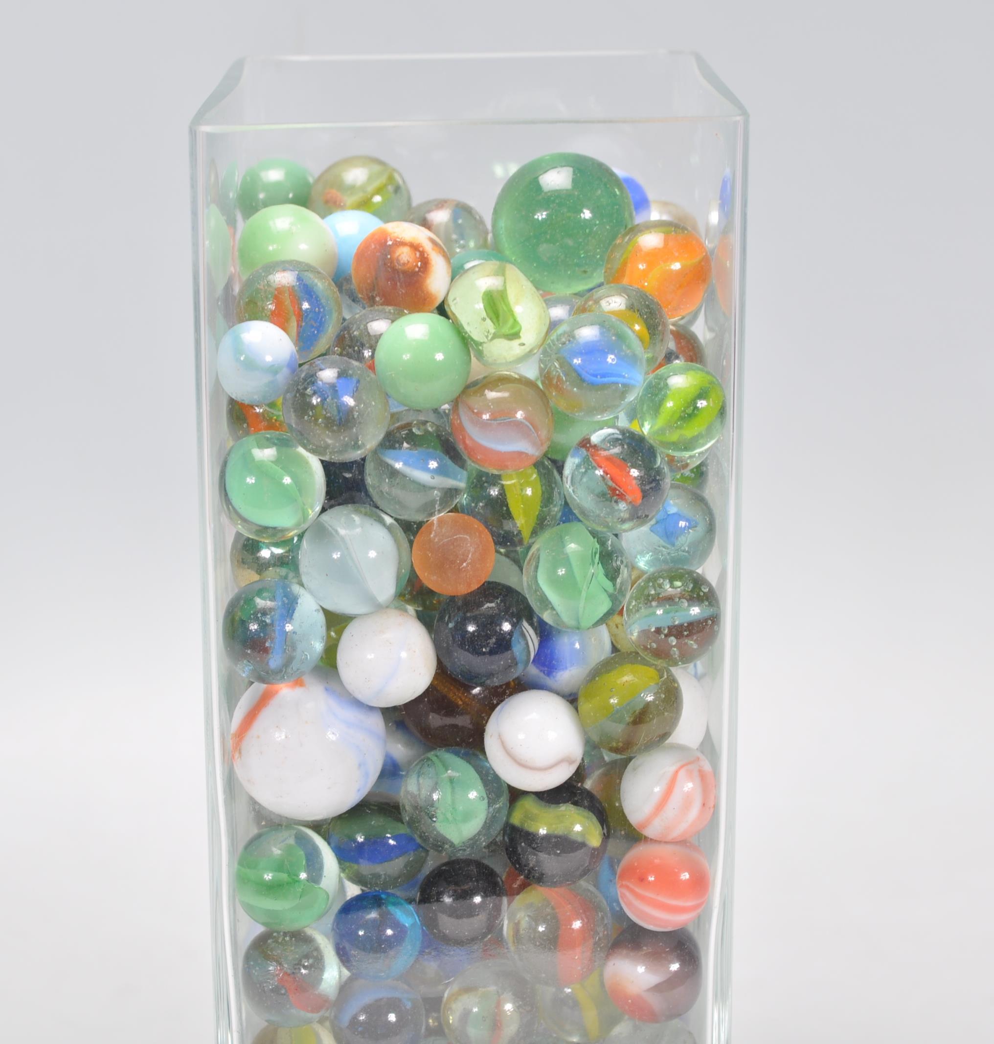 A collection of marbles to include glass cats eye marbles, some white and coloured glass examples, - Image 9 of 11