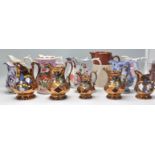 A good collection of Victorian and later water jugs of varying designs and sizes to include luster