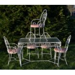 A retro 20th century glass and metal garden cafe table and chairs. The rococo wrought metal frame