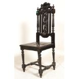 A Victorian 19th century carved oak barleytwist hall chair. Raised on barleytwist legs united by